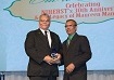 Prof. Prakash Persad presents Eng. Hollis Charles with his award of recognition, for his long-standing support for the institute’s work even beyond his role as Chairman.